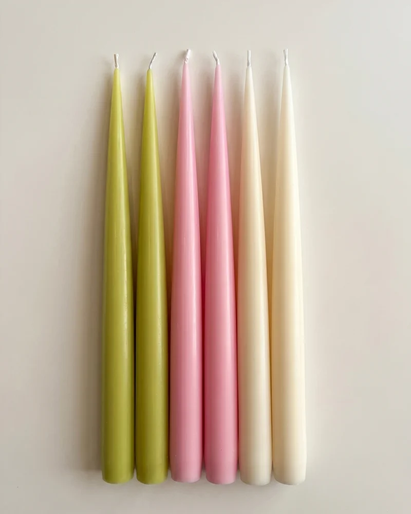 Bloom Six taper candles arranged in pairs of green, pink and ivory