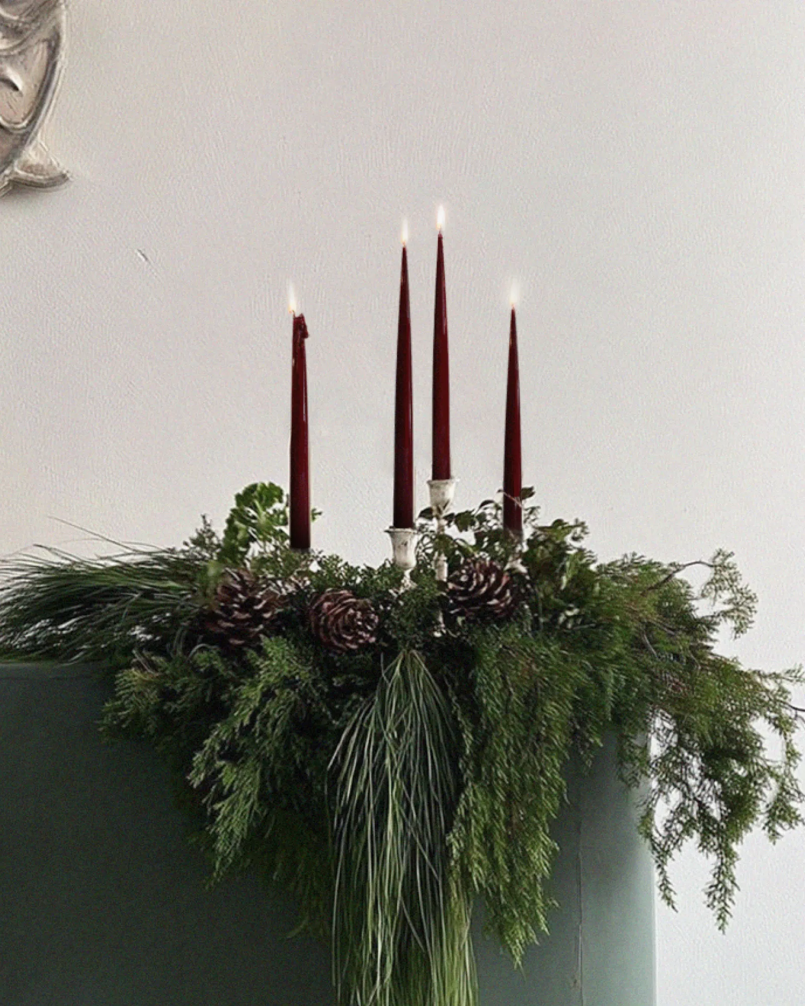 Sculptural candles with a clean, minimal form and smooth surface, standing upright.