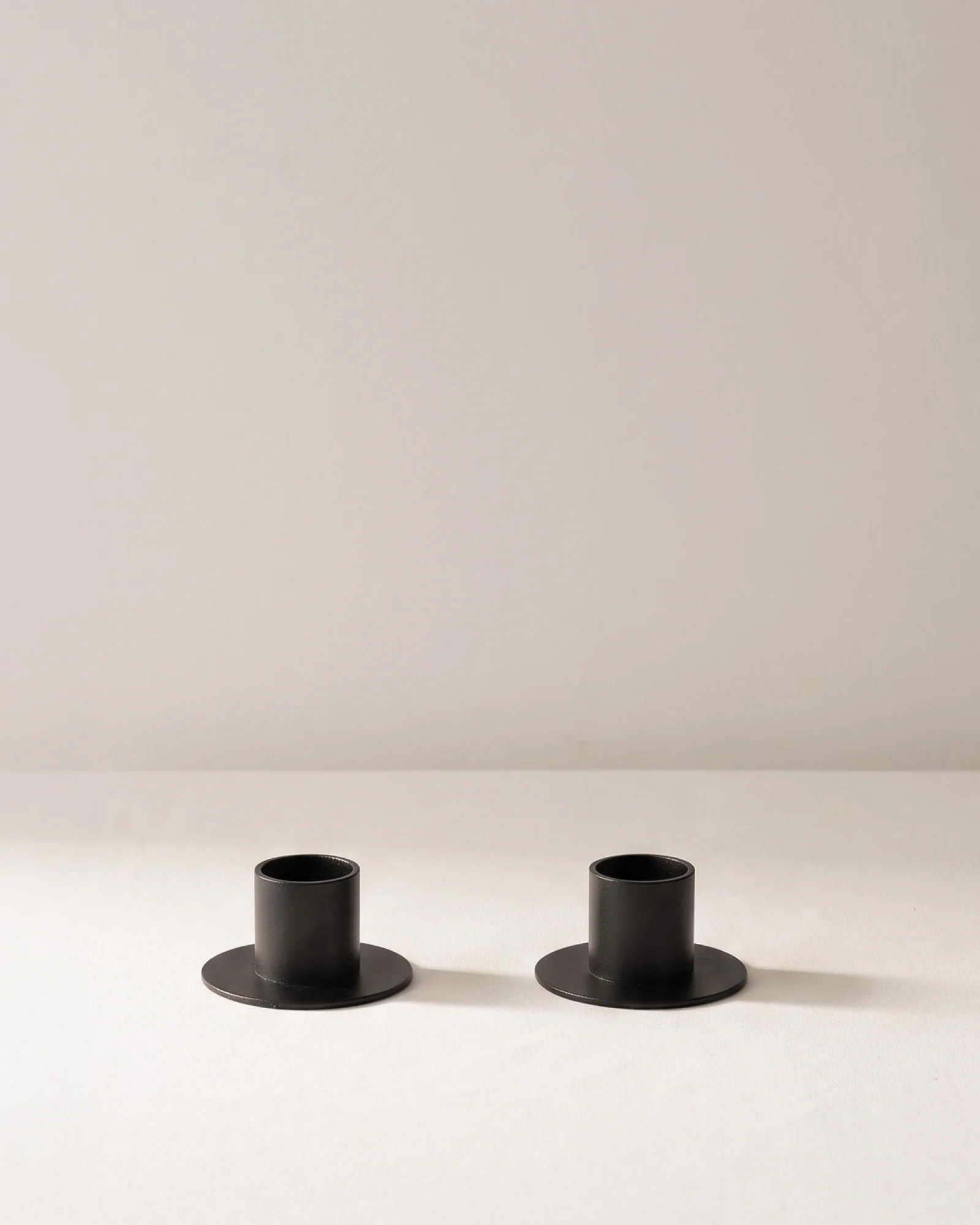 Pair of black Disk Candle Holders with round bases