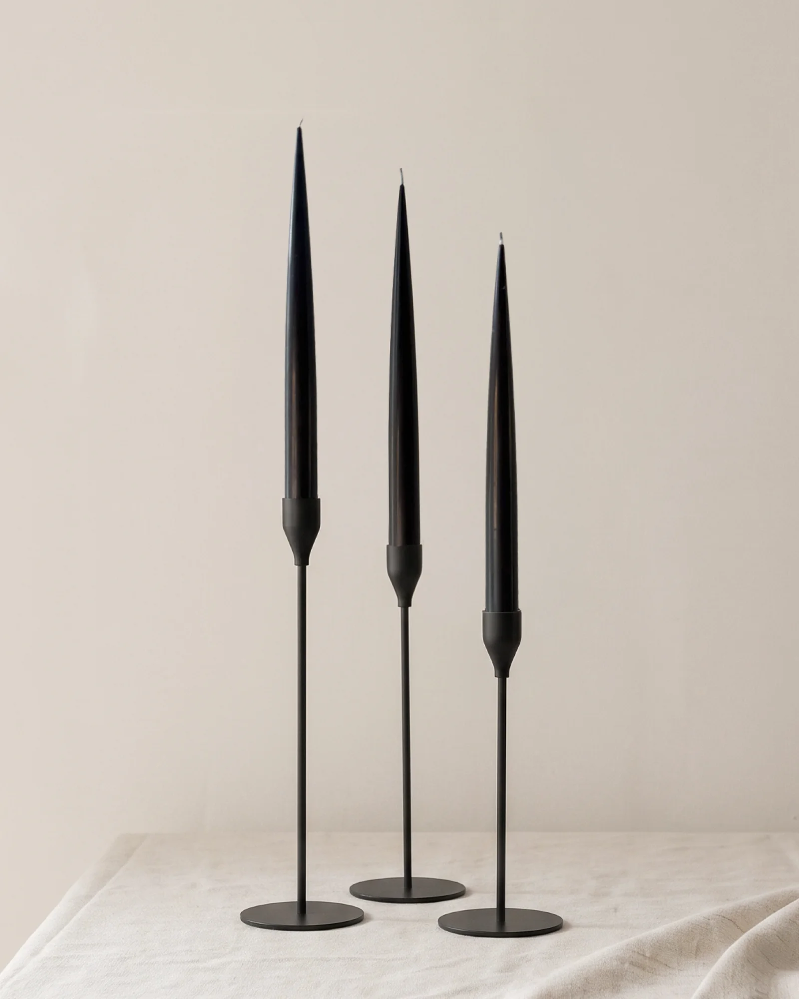 Black minimal candle holders with black taper candles by PLAMYA