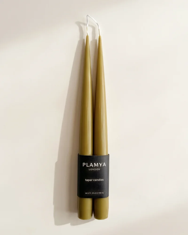 Olive taper candle pair wrapped with a black PLAMYA paper band